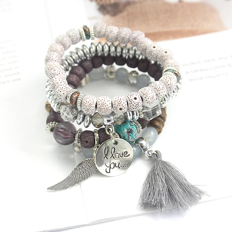 

Perline colorate bodhi fatte mano con bracciale con scritte "love you" in metallo con nappine in piuma d'oro alla ragazza amata