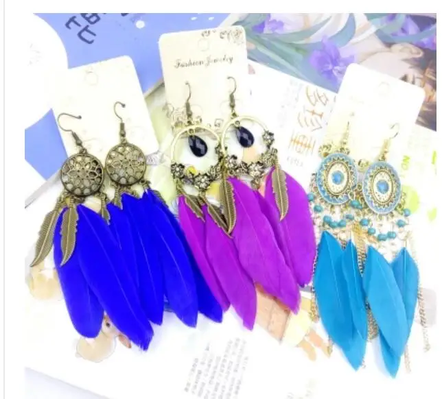 

2018 High Quality Women's Jewelry Lucky Feather Tassle Earrings Ladies Round Hollow Out Metal Earrings