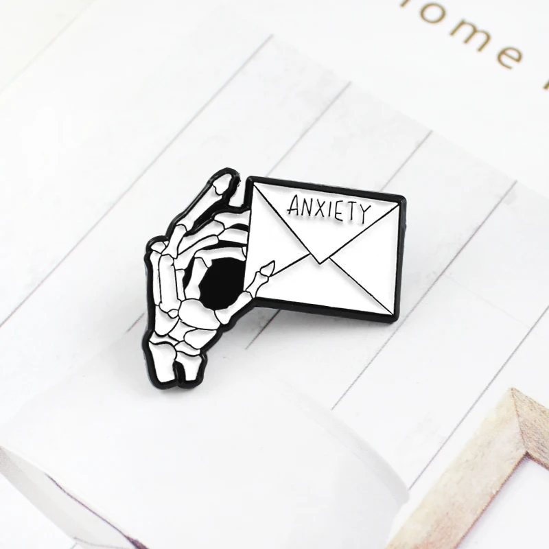 

New skeleton delivery hand "ANXIETY" Gothic brooch bone finger holding creed letter brooch fashion personality badge Halloween