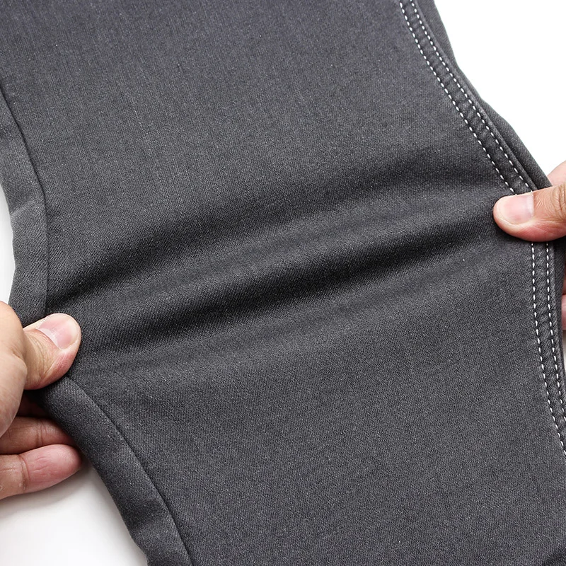 Cena Zimowe jeansy dla mężczyzn ciepłe męskie Pantalones Pitillos Hombre Jean Homme męskie ubrania szare klasyczne znane marki Jing Stretch