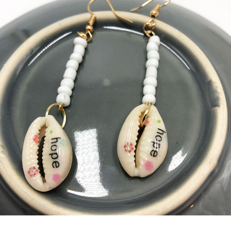 

2019 The Latest Self Created Earrings Personality Leopard Shell Hand Pendant Designer To Make Ear Ornaments Popular Wholesale