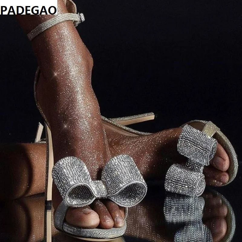 

2019 European and American silver diamond bow ultra high heel (above 8CM) stiletto with a belt fashion sandals