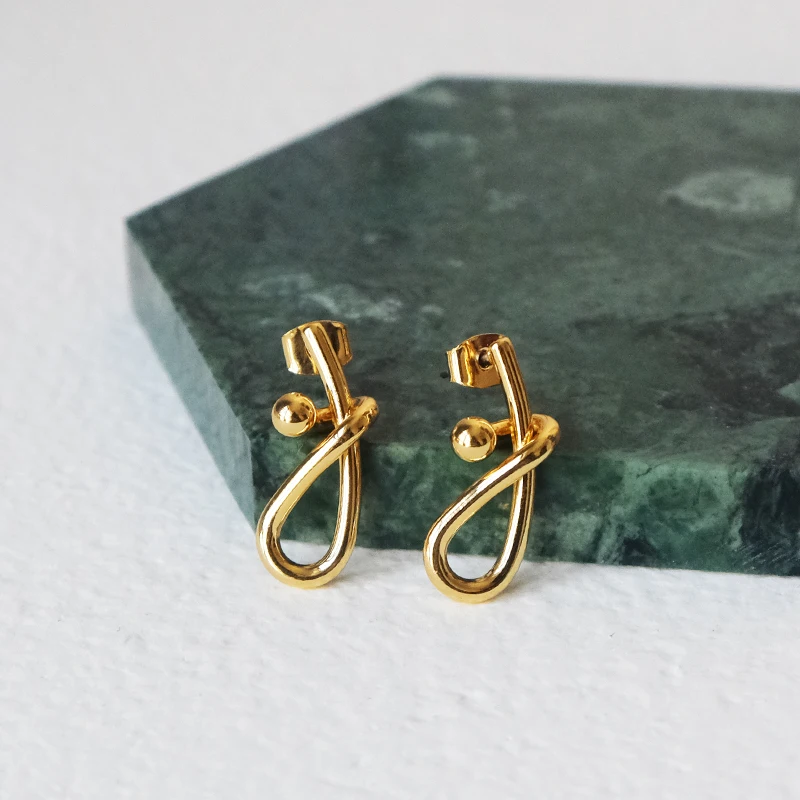 

European and American simple-line tie-up earrings small winding earrings metal ball earrings small personality French female