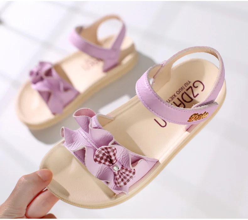 Новые летние сандалии для девочек из натуральной мягкой кожи; удобные, с бантом, туфли принцессы Детские носки для малышей, летние туфли на плоской подошве для девочек