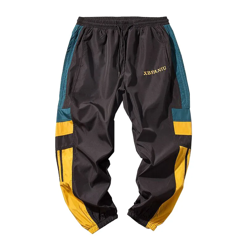 ركض Sweatpants الرجال عارضة سروال مخطط الأزياء فضفاض السراويل الترنك الرجال عرق السراويل الرياضية اليابانية الشارع الشهير الأبيض الأسود