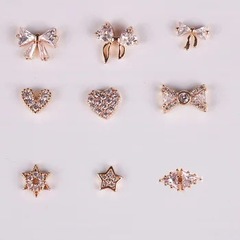 

Gold Alloy 3d Nail Art Decorations for Rhinestone Nail Jewelry Charms Bow Tie Heart Pattern Nail Design 10pcs 2018 ER003