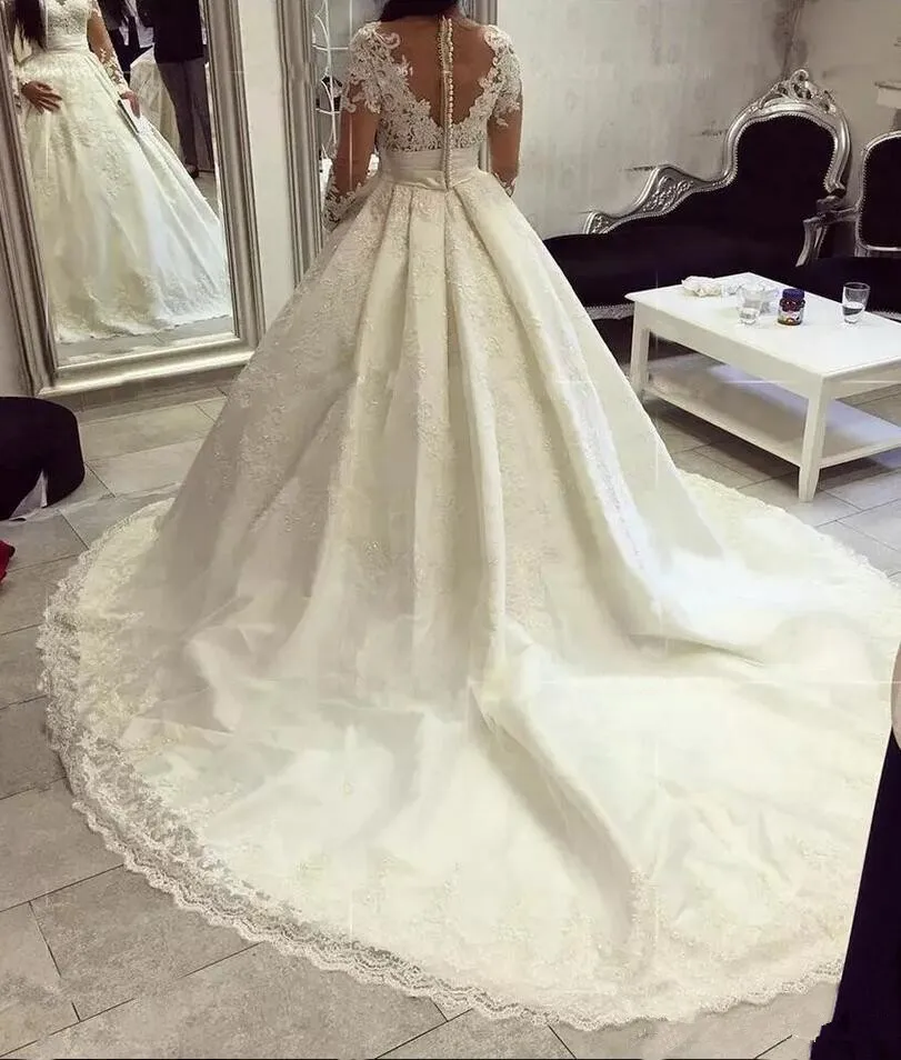 illusion-appliques-long-sleeves-a-line-castle-wedding-dresses-2019-sexy-v-neck-button-back-lace-skirt-bridal-gowns-2018-robe-de-marriage (5)_
