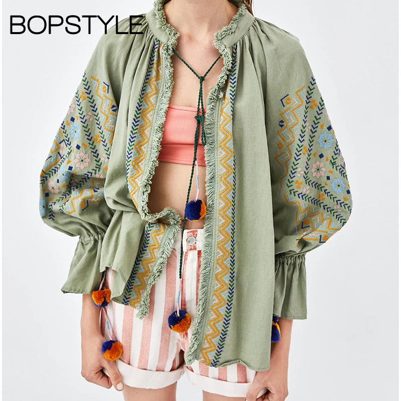

Fall 2018 Raised Collar Embroidered Jacket Features String Fastening Front With Pompoms & Fringed Trims & Gathered Ruffle Cuffs