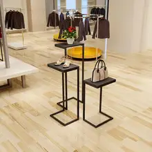 A vintage display stand in a vintage display stand of a clothing store quality ferrofluid magnetic display in a bottle creative toy