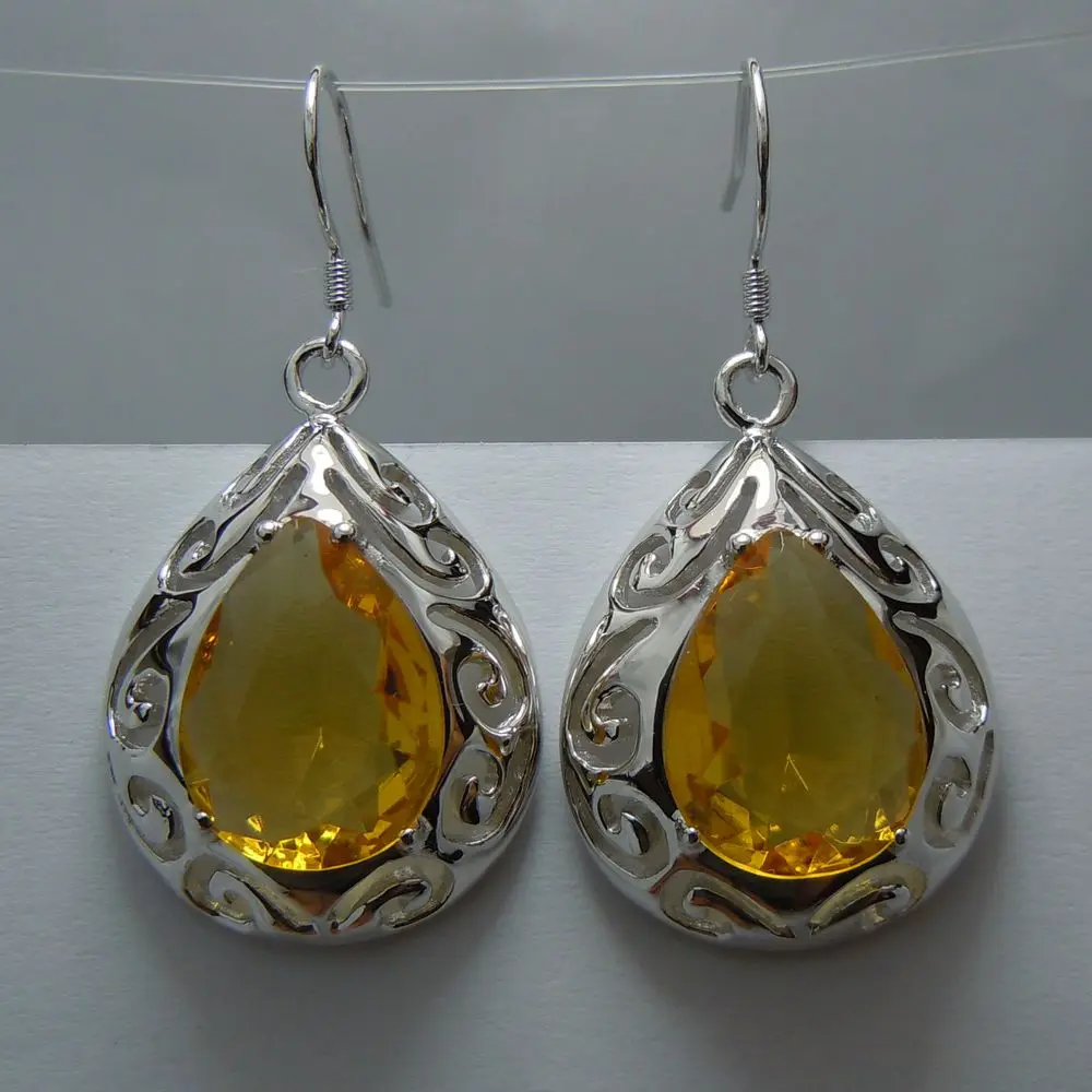 

Free delivery service delivery of the Victorian era carving hollow out water droplets form yellow crystal 925 silver earring
