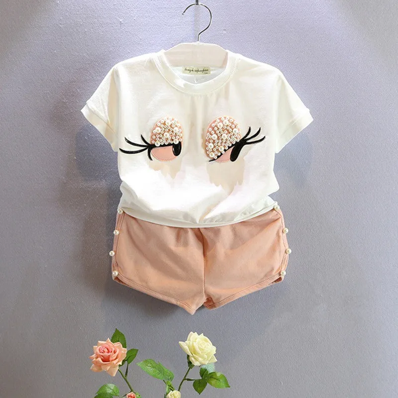 

2016 New Summer Kids Sets Girls Clothes Set Fashion Pearl Big Eye Lashes Short Sleeve Top Shors Suit Girls Clothing Ses 2-7Y