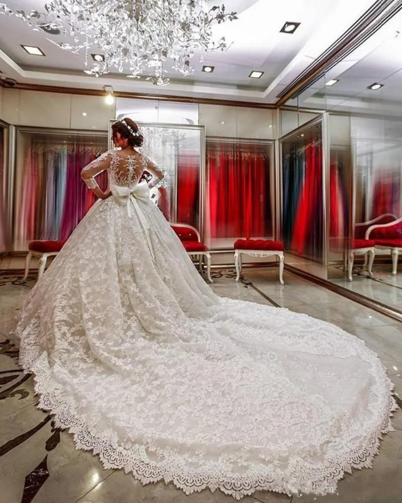 2017-ball-gown-wedding-dresses-sheer-neck-illusion-three-quarter-sleeves-lace-applique-beads-open-back-sash-bow-cathedral-train-bridal-gowns (2)