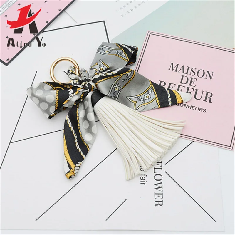 

Attra-Yo Fashion Hot Sale Scarves Key holder Bowknot Exquisite Decoration PU Leather Tassels Keychains Women Bag Charm Pendant