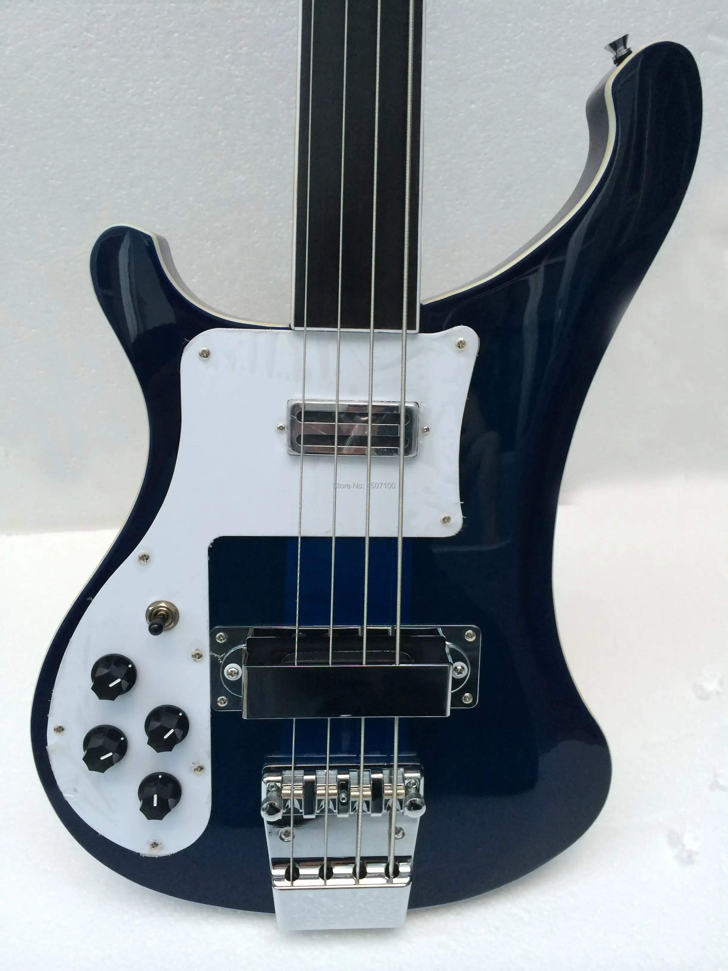 left handed fretless 4003 bass guitar in transparent blue color;thru