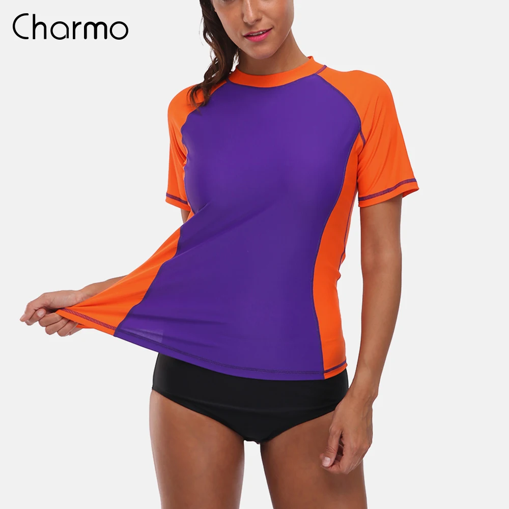 Charmo النساء قصيرة الأكمام طفح الحرس قمصان Rashguard ملابس تصفح أعلى UPF 50 + تشغيل قميص ركوب الدراجات قميص ملابس السباحة بدلة ركوب الأمواج