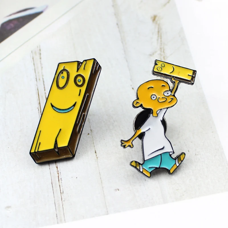 

Anime Cartoon character Small bald head Funny expression wooden block Enamel brooch Cool boy personality Yellow badge Denim pin