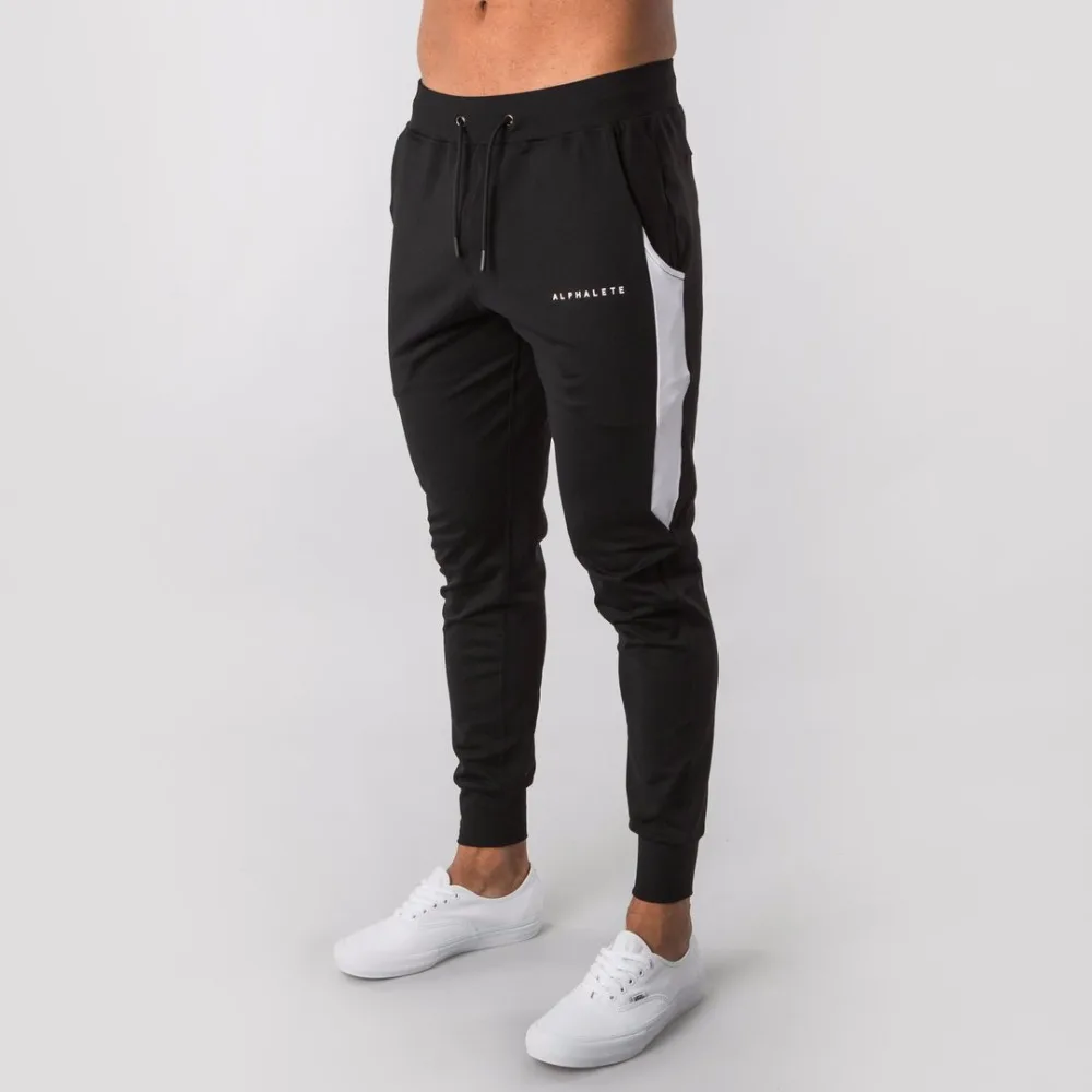 Comprar 2019 nuevo ALPHALETEGyms pantalones de correr para hombres Pantalones deportivos de marca de moda Casual pantalones de chándal pantalones de Snapback inferior pantalones casuales para hombres