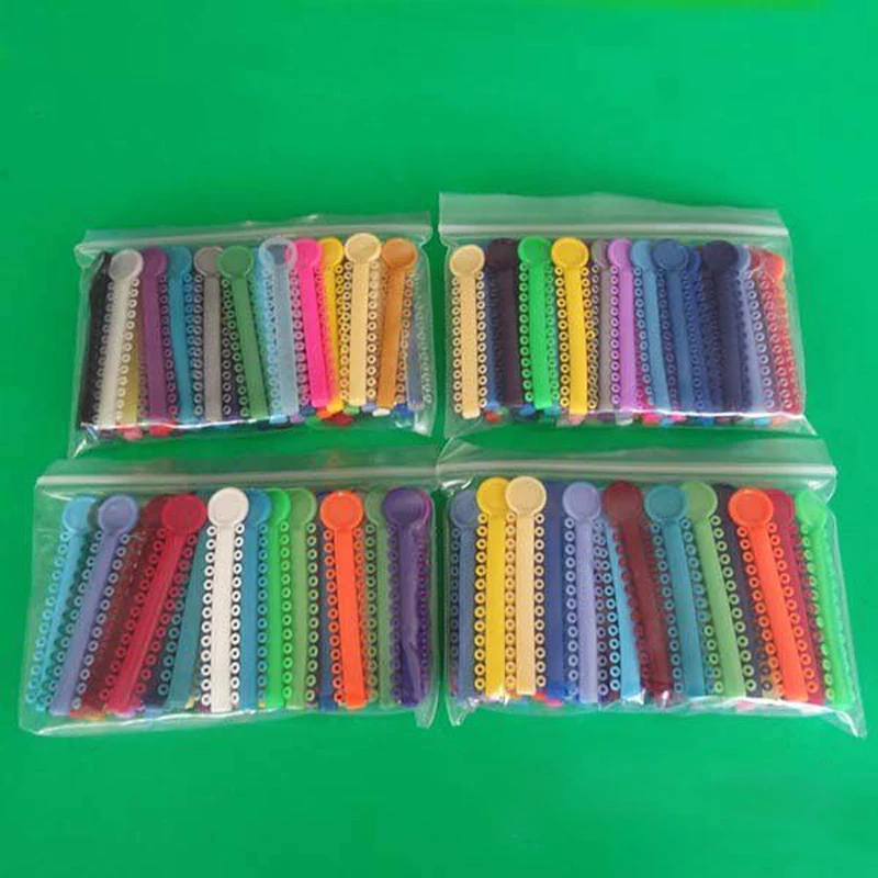 

Denxy 1040pcs/bag ( 4pack) Dentistry Orthodontic ligating strip Color Dental ligatise ring Dental Brace Orthodontics Material