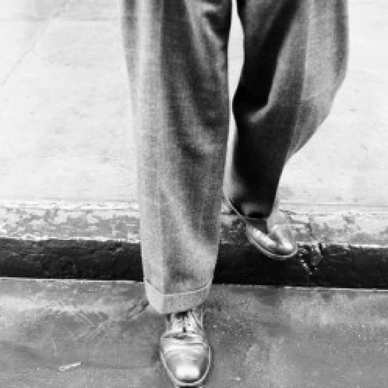 Man standing on pavement in rain  low section Poster Print (18 x 24)