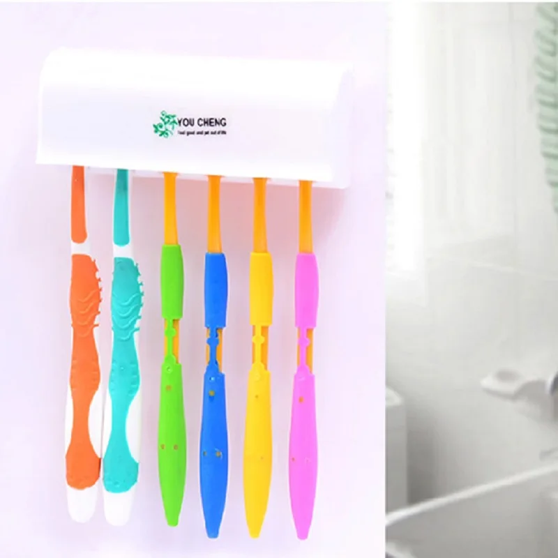 الأبيض البلاستيك جدار جبل حامل فرشاة الأسنان حمام المنزل فرشاة أسنان فرشاة سبين شفط حامل حامل مع غطاء الوجهين الشريط