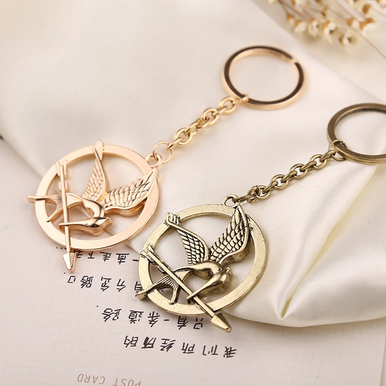 

Hunger Games Keychain Bird Eagle Arrow Logo Keyring Key Holder Chain Ring Vintage Fashion Animal Jewelry Men Women Kid Wholesale