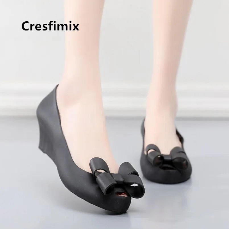 

Cresfimix Chaussures Plates Femmes Women Cute Sweet Bow Tie Black Slip on Shoes Lady Wedge Heel Jelly Waterproof Shoes E5107