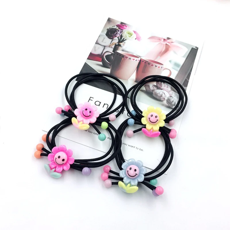 

10PCS 2019 cute cartoon children's hair accessories to the sun, flower head rope, new hair rope, three-in-one leather, head rope