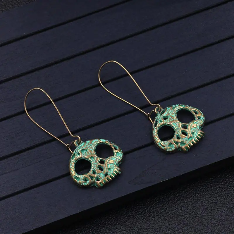 

New skeleton hollow eyes resin earrings bronze blue green ear hook personality national wind earrings female jewelry gift