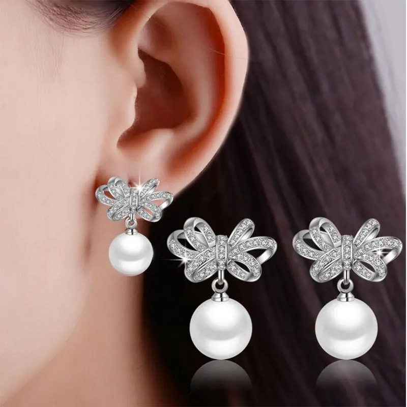 

Anenjery 925 Sterling Silver Jewelry Shiny CZ Zircon Bowknot Pearl Stud Earrings pendientes boucles d'oreilles oorbellen S-E351