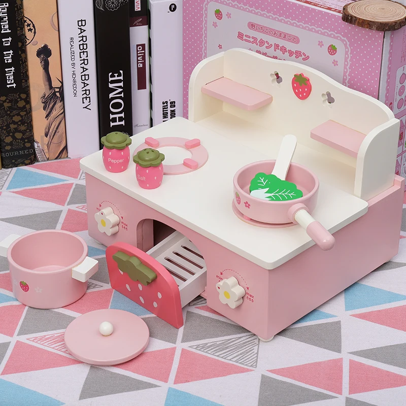 pink wooden toy kitchen