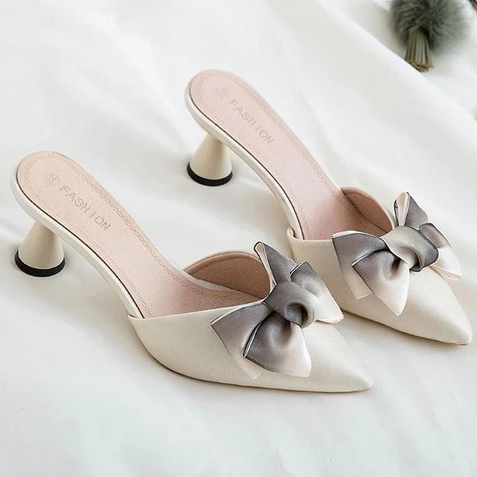 nude bow mules