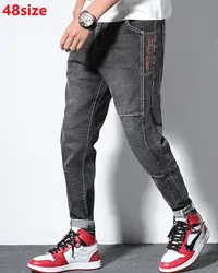 Весенние мужские джинсы мужские эластичные сшитые синие трендовые шаровары свободные большие размеры толстые длинные брюки серые