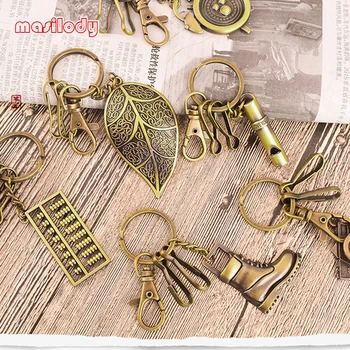 

100pcs/Lot Classic Bronze Keychain Leaf Whistle Cap Key Chains Metal Abacus Giraffe Boots Keyrings Camera Clock Flower Key Rings