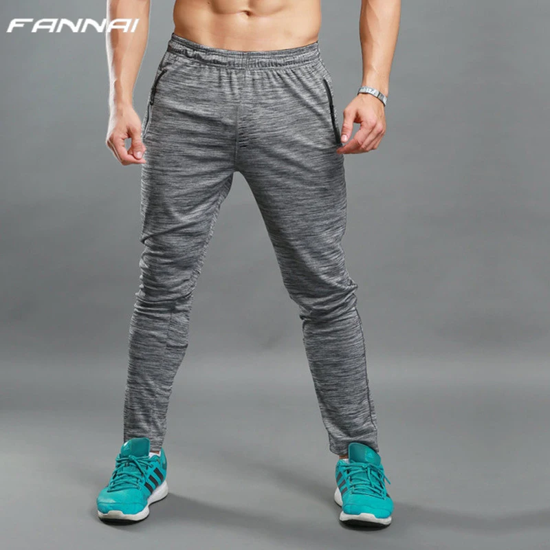 Tanie Mężczyźni przebiegu spodnie do joggingu kieszenie siłownia sport sportowe piłki nożnej piłka nożna szkolenia sportowe spodnie elastyczność na zewnątrz spodnie do joggingu
