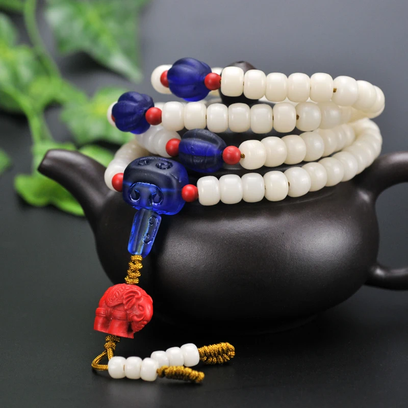 

The original design of white jade Buddha hand string beads bracelet