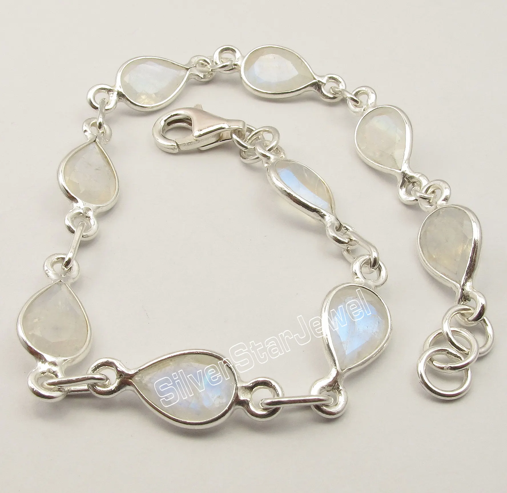 

Chanti International . Silver BLUE FIRE DROP RAINBOW MOONSTONE ART Bracelet 8 3/8 Inches