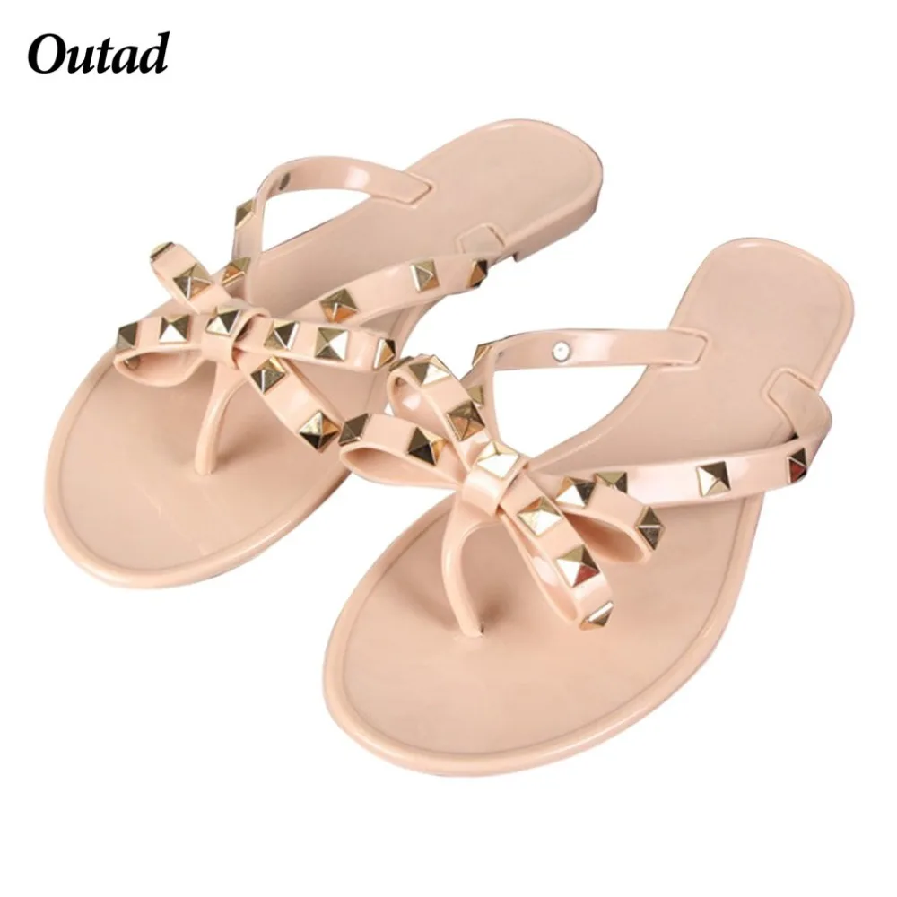 

OUTAD Fashion Woman Flip Flops Summer Beach Rivets Bow flat Plastic Sandals Jelly Shoes Sandals For Girls
