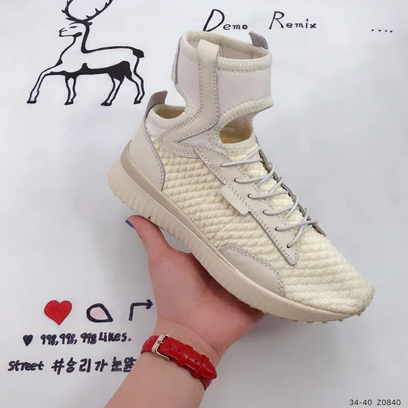 

Rihanna with Fenty X Rihanna Trainer Hi Cutout Socks Women's Casual Shoes