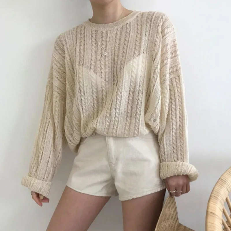 

Hollow knitted twist sweater with slight penetration and loose round collar
