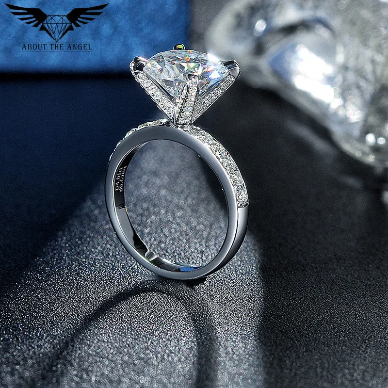 

14 K White Gold Sparkle Moissanite Diamond Rings With Melees