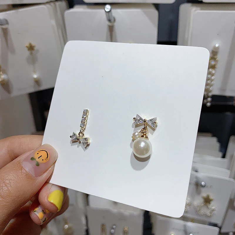 

Dominated 2019 new fashion sweet crystal Women earrings Asymmetric bowknot joker temperament pearl Drop earrings