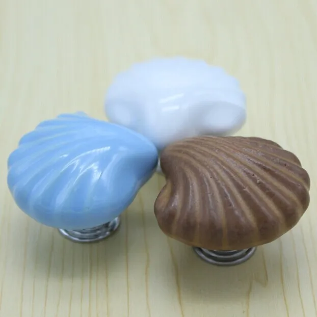 القوقع شكل كارتون الأطفال غرفة السيراميك المقابض ، أزرق أبيض مكتب السيراميك درج خزانة خزانة مقابض التأثيرات المقابض الاطفال المقبض