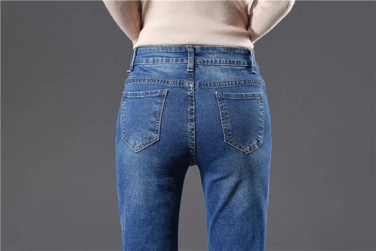 Корейский большой размера плюс расклешенные джинсы для женщин высокие Стрейчевые узкие длинные широкие джинсы женские джинсовые брюки с разрезом и боковыми пуговицами