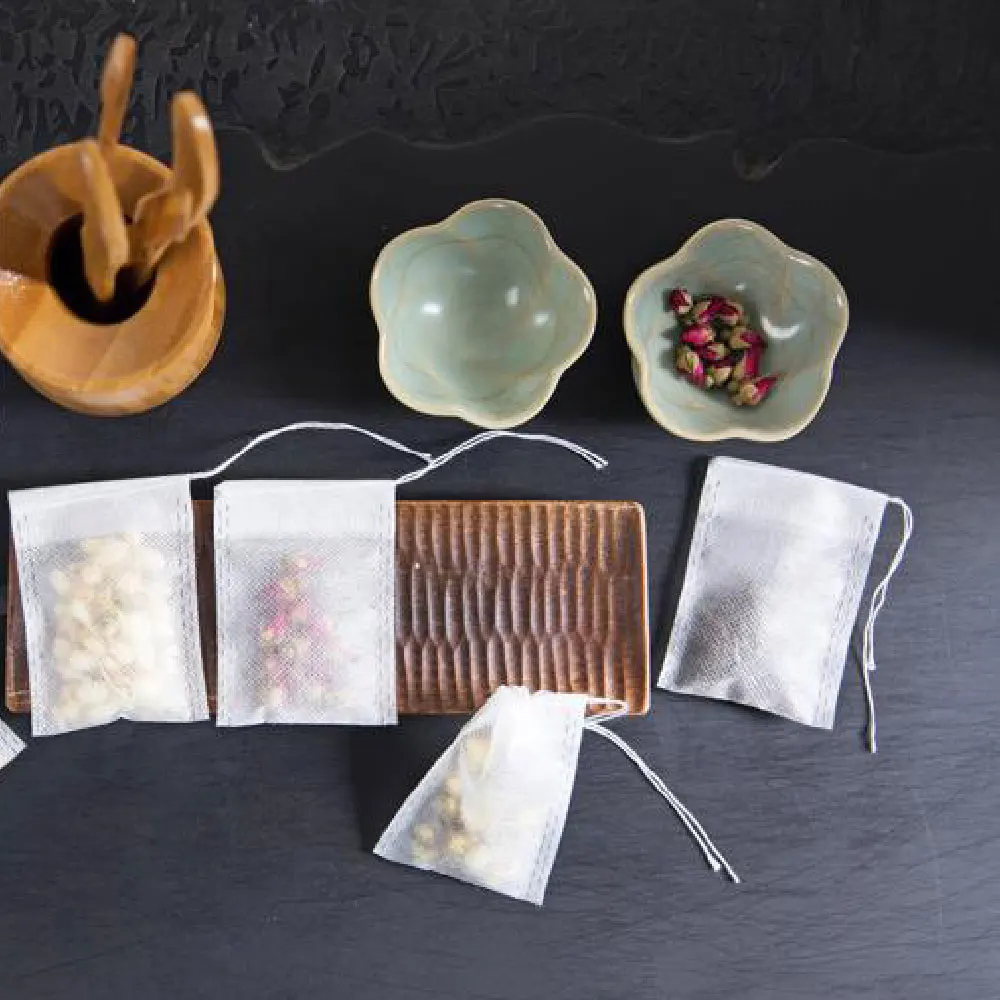 

Non-Woven 100Pcs Paper Empty Draw String Teabags Heat Seal Sieve Herb Loose Tea Bag Colander Gadgets For The Kitchen Novelties