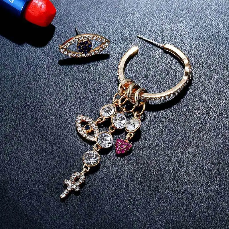 

2019 New Bohemian Asymmetric Gold Color Pink Blue Crytal Eyes Cross Drop Earring for Women Tiny Geometric Evil Eyes Earrings