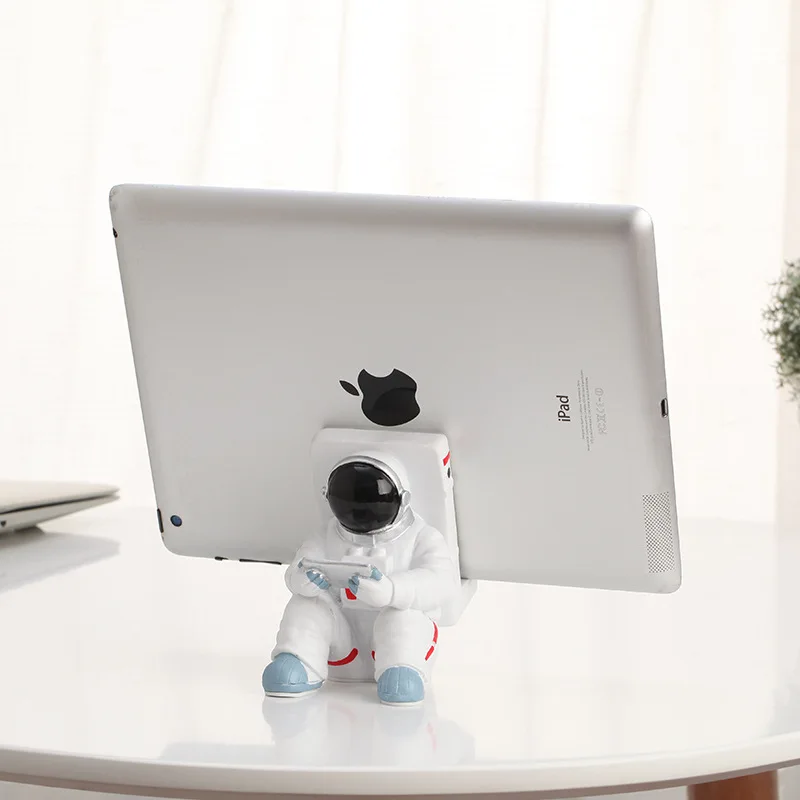 

[New] Creative Space Man Astronaut Sculpture Rocket Plane Cosmonaut Phone holder figure model ornament Statue Home Decorations
