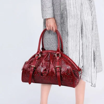 

2019 new genuine leather handbag female original Chinese style oracle bone pattern middle-aged female bag dumplings package