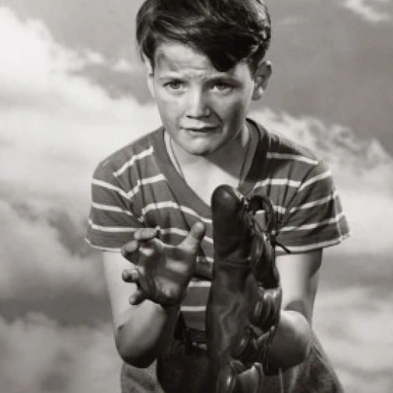 Boy trying to catch with a baseball glove Poster Print (18 x 24)