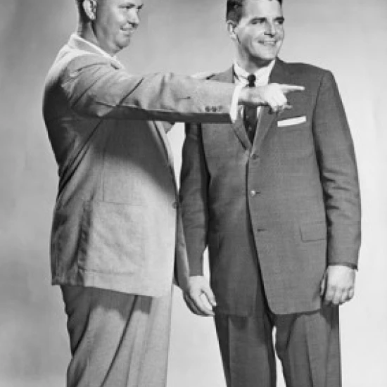 Two businessmen standing together  one pointing Poster Print (24 x 36)