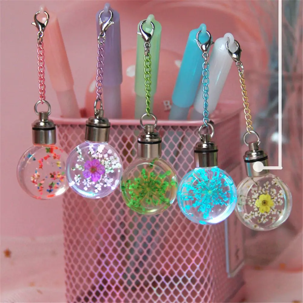 

Gel Pen Lovely Candy Color Dried Flowers Pendent with Colorful Light Pen Multi-function 0.5mm Black Ink Bulb Pen Gifts
